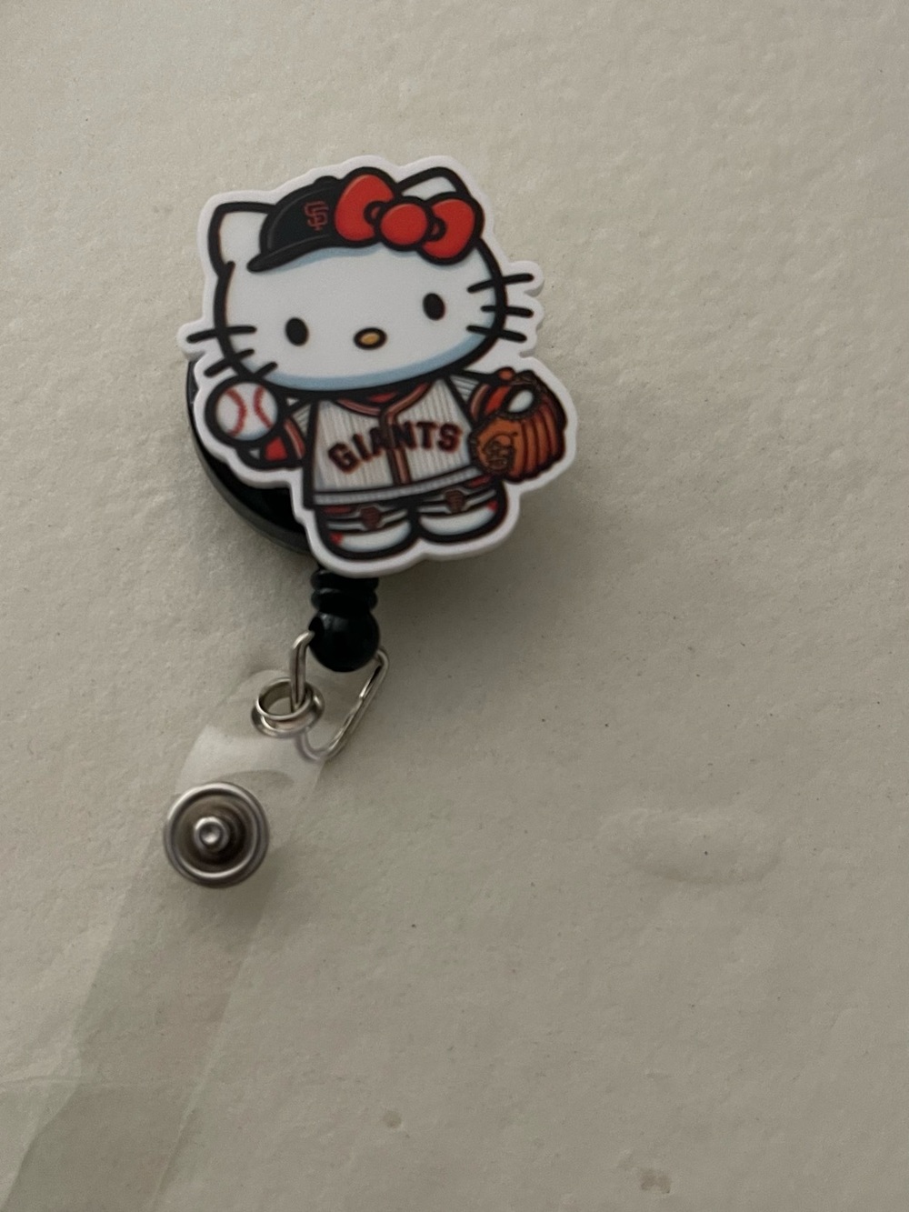 Hello Kitty San Francisco Giants Badge Reel — White, orange, and Black